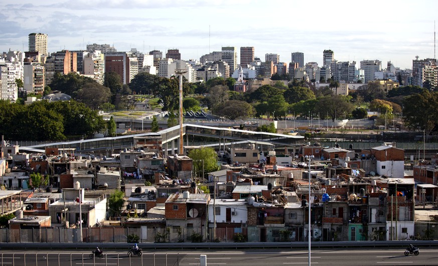 This Oct. 4, 2016 photo shows the Villa 31 neighborhood, backdropped by downtown, as well as middle class apartments and office buildings in Buenos Aires, Argentina. Many of the country&#039;s poor li ...