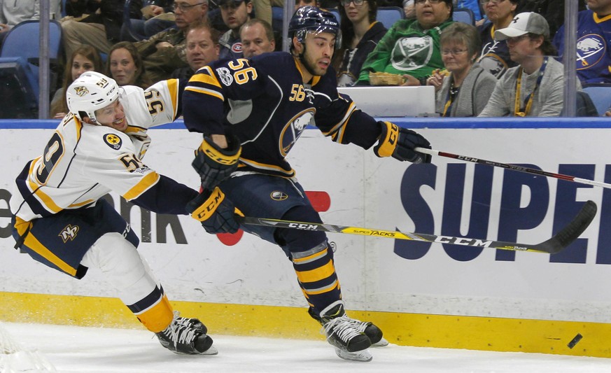 Buffalo Sabres forward Justin Bailey (56) is chased by Nashville Predators defenseman Roman Josi (59) during the first period of an NHL hockey game, Tuesday, Feb. 28, 2017, in Buffalo, N.Y. (AP Photo/ ...