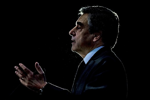 epa05862283 French right-wing party &#039;Les Republicains&#039; candidate for the 2017 French presidential elections, Francois Fillon, delivers a speech during an election campaign meeting in Courbev ...