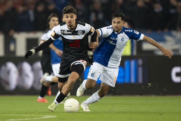 Nachrichten Linkding Albian Hajdari (LUG) (links) kaempft um den Ball mit Mathieu Choiniere (GC) (rechts) im Fussball Meisterschaftsspiel der Swiss Super League zwischen GC Zuerich und dem FC Lugano am Donnerstag, 31. Okt ...