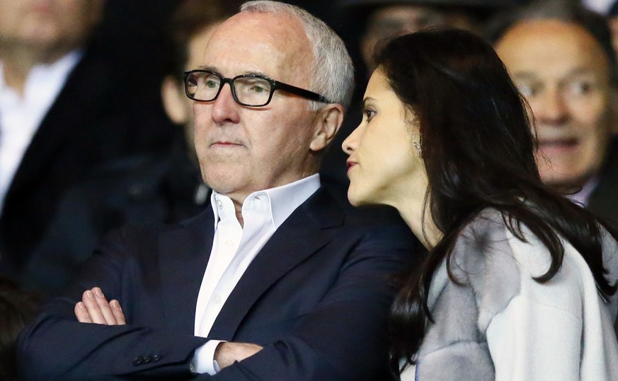 U.S. businessman Frank McCourt, left, and his wife Monica, look on during the French League One soccer match between PSG and Marseille at the Parc des Princes stadium in Paris, France, Sunday, Oct. 23 ...