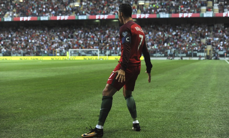 Portugal&#039;s Cristiano Ronaldo celebrates after scoring the opening goal during the World Cup Group B qualifying soccer match between Portugal and Faroe Islands at the Bessa Stadium in Porto, Portu ...