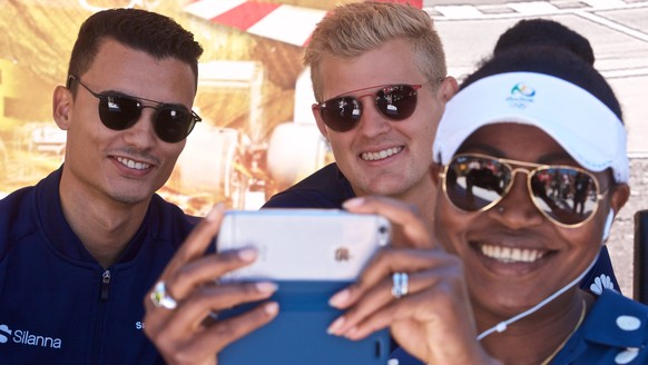 epa06017151 German Formula One driver Pascal Wehrlein of Sauber F1 Team (L) and Swedish Formula One driver Marcus Ericsson of Sauber F1 Team pose for a selfie during the public open day for the 2017 C ...