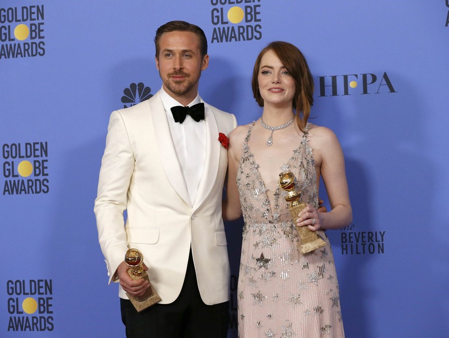 Ryan Gosling and Emma Stone pose with their awards for Best Performance by an Actor in a Motion Picture - Musical or Comedy and Best Performance by an Actress in a Motion Picture - Musical or Comedy f ...