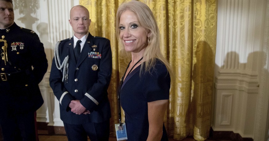 Counselor to the President Kellyanne Conway, center, arrives for a White House senior staff swearing in ceremony in the East Room of the White House, Sunday, Jan. 22, 2017, in Washington. (AP Photo/An ...