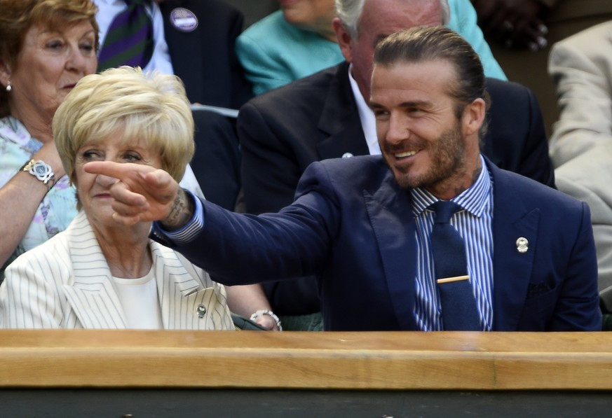 epa06072811 Former England footballer David Beckham and his mother Sandra in the Royal Box on Centre Court during the Wimbledon Championships at the All England Lawn Tennis Club, in London, Britain, 0 ...