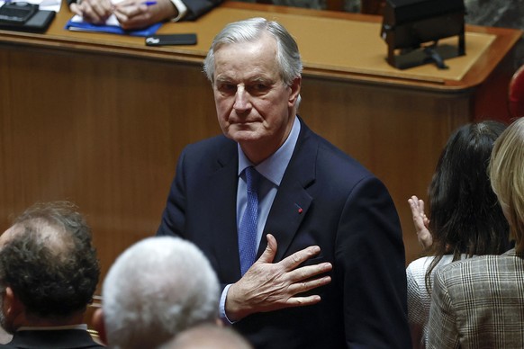 Nachrichten Linkding epa11757078 French Prime Minister Michel Barnier gestures after delivering a speech during a no-confidence vote against his government at the National Assembly, in Paris, France, 04 December 2024. The ...