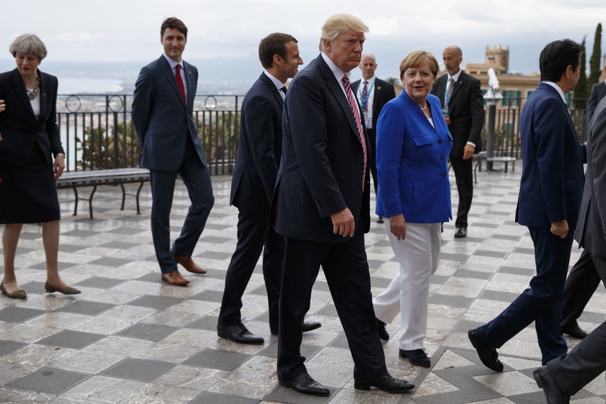 President Donald Trump takes a walking tour with G7 leaders, Friday, May 26, 2017, in Taormina, Italy. From left, British Prime Minister Theresa May, Canadian Prime Minister Justin Trudeau, French Pre ...