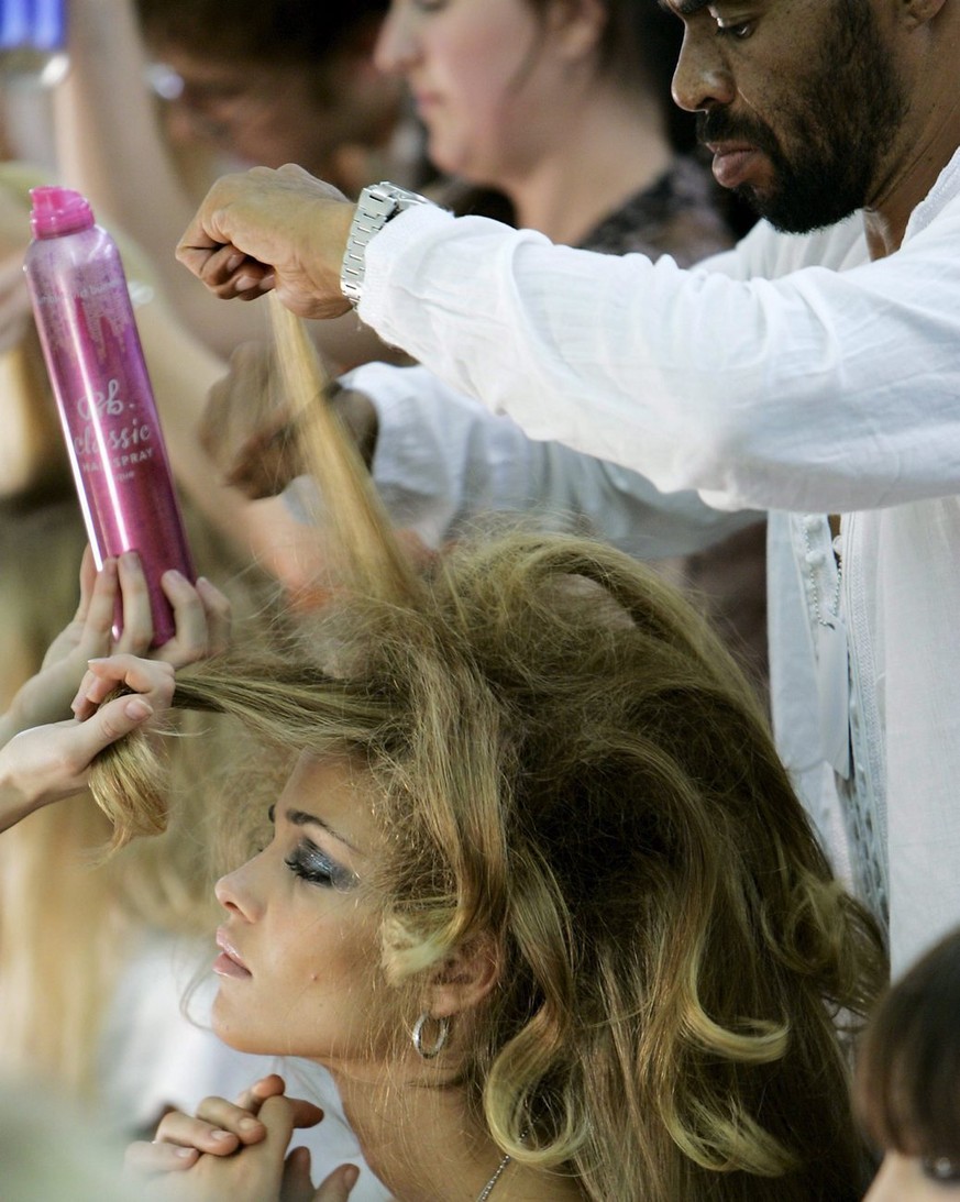 A model gets her hair done backstage before the BabyPhat Fashion Show at Radio City Music hall at Olympus Fashion Week in New York City, Saturday 10 September 2005. EPA/PETER FOLEY