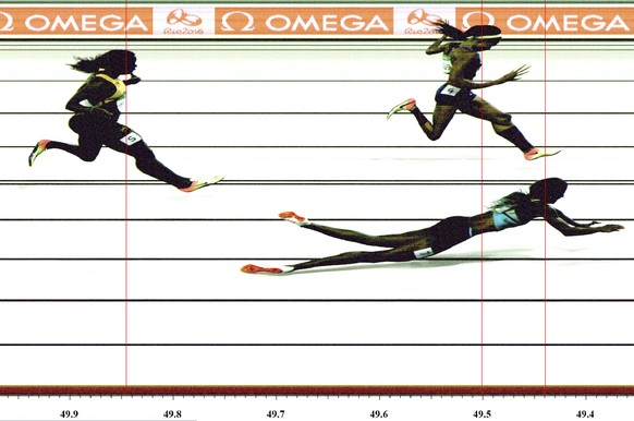 The image provided by OMEGA on Monday, Aug. 15, 2016 shows the photo finish of the women&#039;s 400-meter final when Bahamas&#039; Shaunae Miller, bottom right, falls over the finish line to win gold  ...