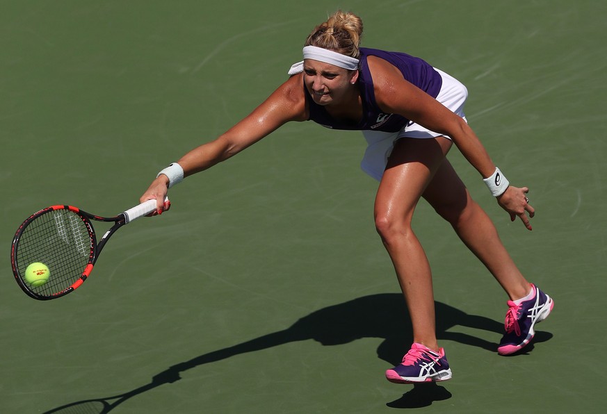 epa05515830 Timea Bacsinszky of Switzerland hits a return to Vitalia Diatchenko of Russia on the second day of the US Open Tennis Championships at the USTA National Tennis Center in Flushing Meadows,  ...