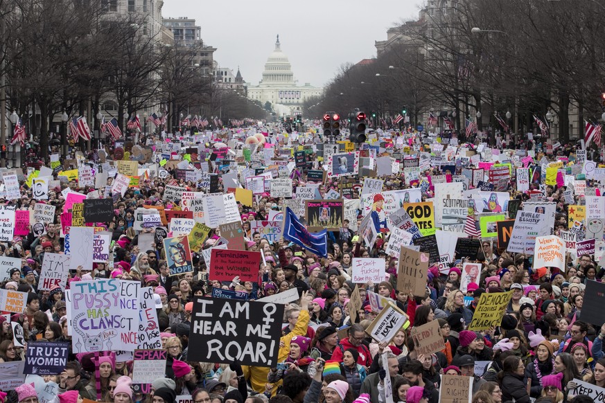 epa05740120 Thousands of people on Pennsylvania Avenue participate in the Women&#039;s March and rally to protest President Donald J. Trump the day after he was sworn in as the 45th President of the U ...