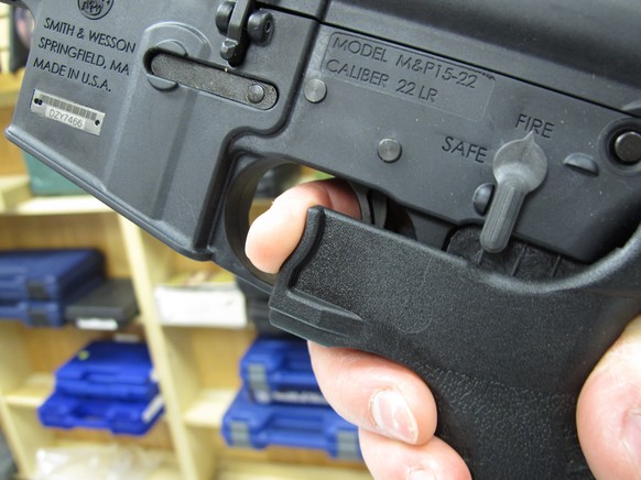 FILE - In this Feb. 1, 2013, file photo, an employee of North Raleigh Guns demonstrates how a &quot;bump&quot; stock works at the Raleigh, N.C., shop. The gunman who unleashed hundreds of rounds of gu ...