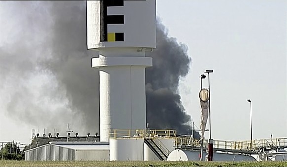 In this image made from video, smoke billows from the site of a plane crash at Essendon Airport in Melbourne, Australia Tuesday, Feb. 21, 2017. An official says a light plane has crashed into a shoppi ...