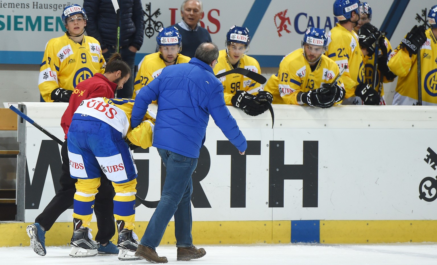 Davos Gregory Sciaroni goes out after a check during the game between Switzerlands HC Lugano and Switzerlands HC Davos at the 90th Spengler Cup ice hockey tournament in Davos, Switzerland, Friday, Dec ...