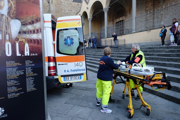 epa06276183 Medical Teams outside Santa Croce Basilica where a 52-year-old Spanish tourist was killed after being struck by a chapiter that fell off the top of a nave in Santa Croce Basilica in Floren ...