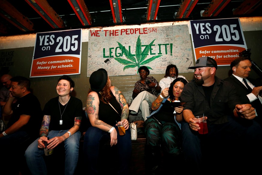 People gather for an election results watch party put on by supporters of Arizona Proposition 205, a legal marijuana initiative, in Phoenix, Arizona, November 8, 2016. REUTERS/Nancy Wiechec