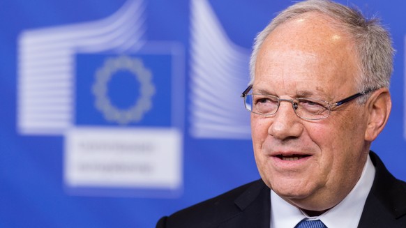 The President of the Swiss Confederation Johann Schneider Ammann addresses the media upon his arrival at the EU Commission headquarters in Brussels on Friday, Jan. 15, 2016. (AP Photo/Geert Vanden Wij ...