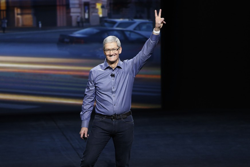 Victory: Bei über 43 Milliarden Dollar Jahresgewinn hat Apple-Chef Tim Cook allen Grund, sich ein bisschen zu freuen.
