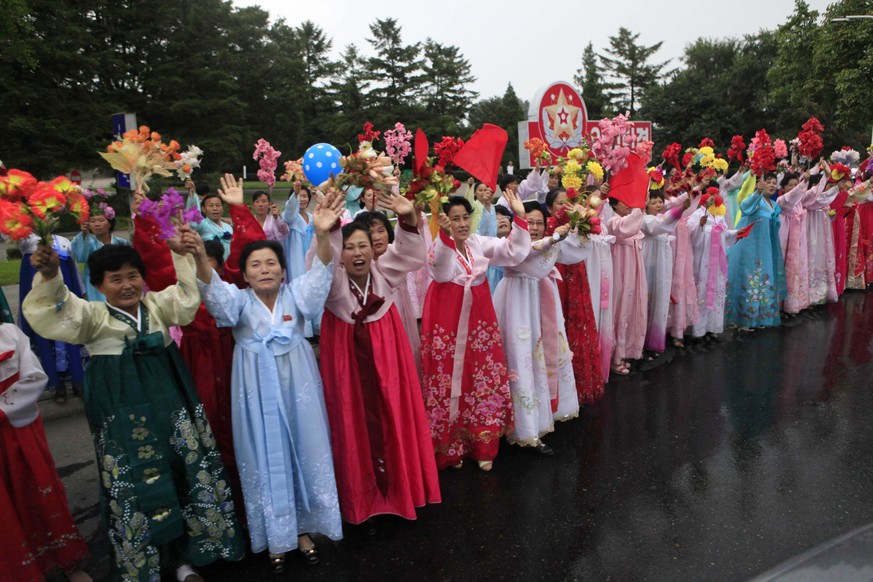 In this Wednesday, Sept. 6, 2017 photo, Pyongyang residents welcome contributors to their country’s sixth underground nuclear test, in Pyongyang, North Korea. The test of what Pyongyang claims was an  ...