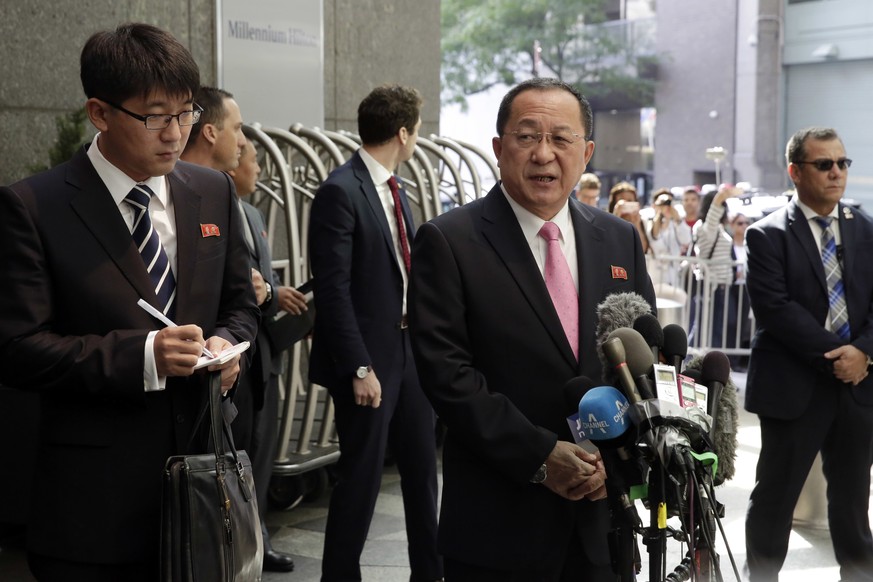 North Korea&#039;s Foreign Minister Ri Yong Ho, center, speaking through an interpreter, left, talks outside the U.N. Plaza Hotel, in New York, Monday, Sept. 25, 2017. (AP Photo/Richard Drew)