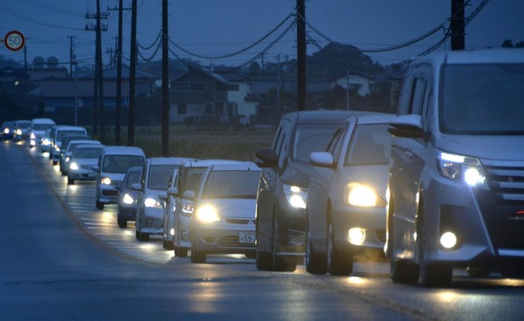 A traffic jam is seen as people evacuate after tsunami advisories were issued following an earthquake, in Iwaki, Fukushima prefecture, Japan, in this photo taken by Kyodo November 22, 2016. Mandatory  ...