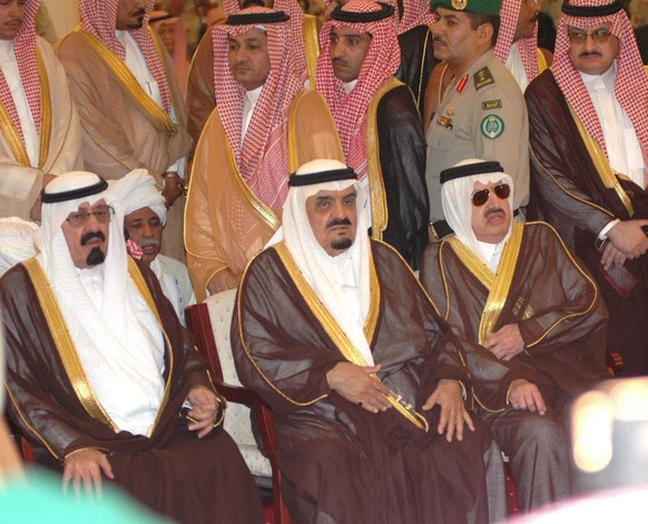 Saudi King Abdullah Bin AbdullAziz (L) and Prince Mohammed bin Saudi (C) attend the funeral ceremonies of late Saudi Arabian King Fahd during the funerals in Riyadh, Saudi Arabia, 02 August 2005. Doze ...