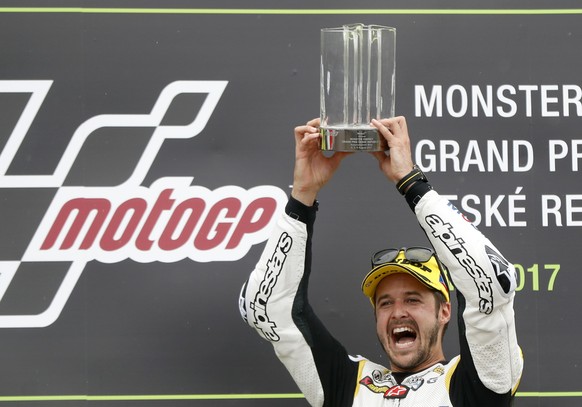 Switzerland&#039;s Moto2 rider Thomas Luthi of the CarXpert Interwetten celebrates his victory in the Moto2 race at the Czech Republic motorcycle Grand Prix at the Automotodrom Brno, in Brno, Czech Re ...