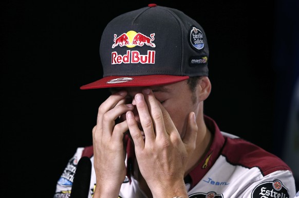 Estrella Galicia MotoGP rider Jack Miller of Australia covers his face during an official pre-race press conference ahead of the Australian Motorcycle Grand Prix at Phillip Island, Australia, Thursday ...