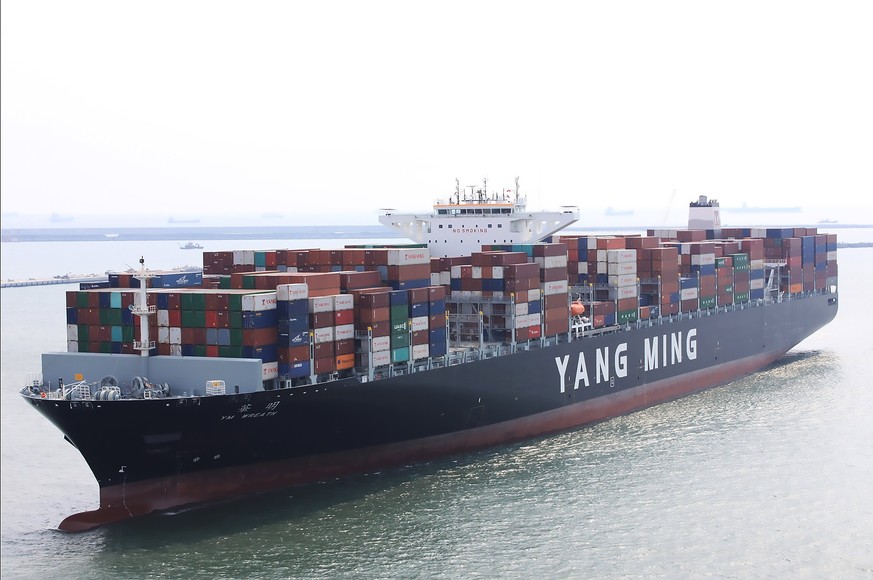 epa06187039 A handout photo made available by the Taiwan International Ports Corp Ltd on 06 September 2017 shows the 14,000-TEU container ship YM Wreath of the Yangming Marine sailing into the Kaohsiu ...