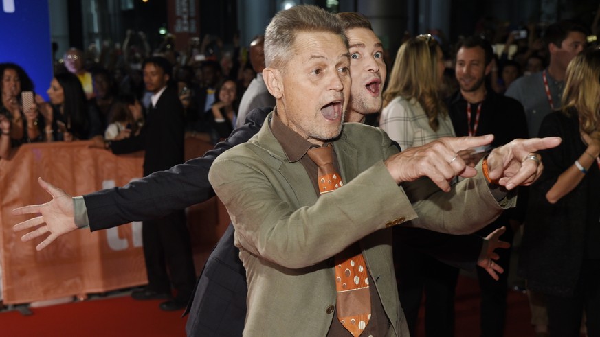Jonathan Demme, left, director of the concert film &quot;JT + The Tennessee Kids,&quot; and Justin Timberlake react to photographers at the premiere of the film on day 6 of the Toronto International F ...