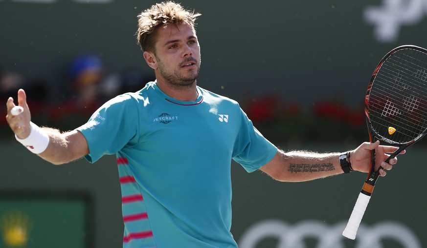 epa05858996 Stan Wawrinka of Switzerland reacts after missing a shot against Roger Federer of Switzerland in their finals match at the 2017 BNP Paribas Open tennis tournament at the Indian Wells Tenni ...