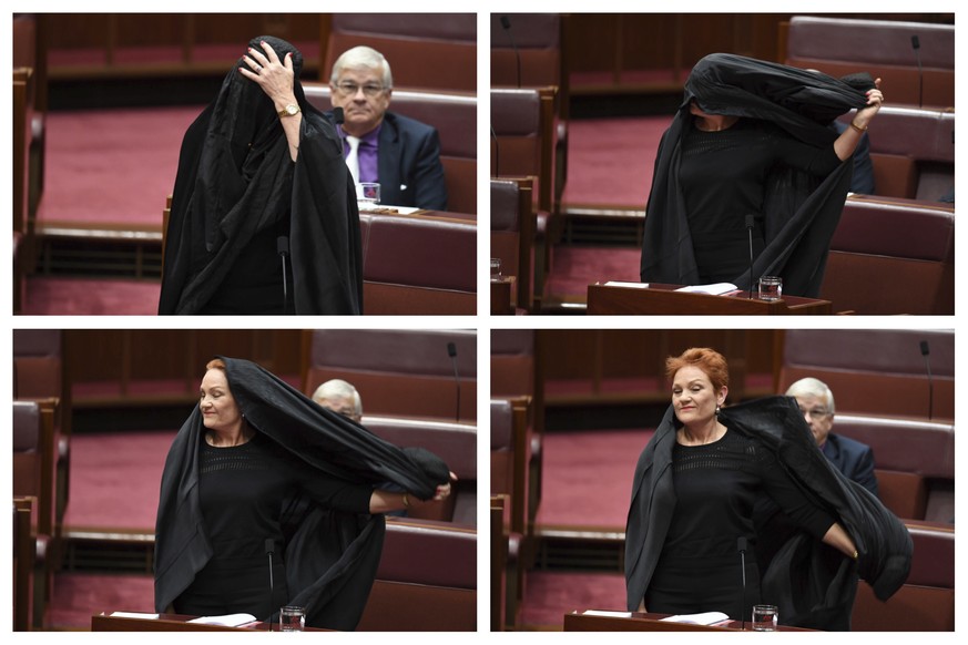 In this combination of photos Sen. Pauline Hanson takes off a burqa she wore into the Senate chamber at Parliament House in Canberra, Australia, Thursday, Aug. 17, 2017. Hanson, leader of the anti-Mus ...