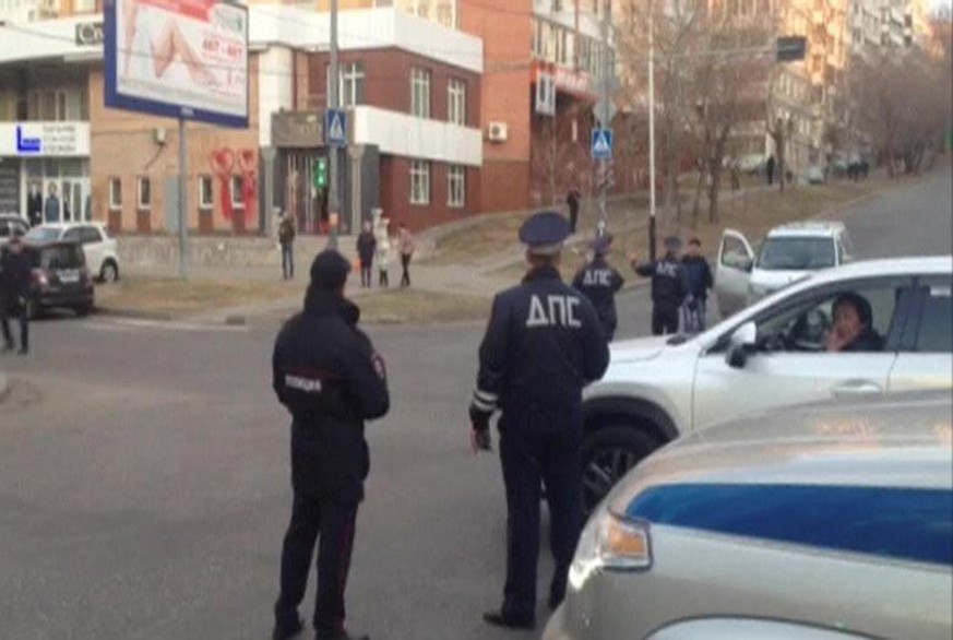 A still image from a video footage shows Interior Ministry officers block a street near a regional office of Russia&#039;s Federal Security Service (FSB), which was attacked by a gunman, in Khabarovsk ...