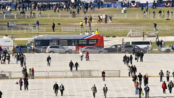 FILE - In this Jan. 19, 2013 file photo crews lay down special mats to protect the lawn on the National Mall, for the 57th Presidential Inauguration in Washington. White House Press Secretary Sean Spi ...