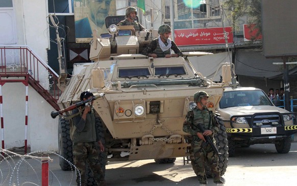 Soldaten des afghanischen Militärs in Kundus: Berichten zufolge haben die Taliban erste Regierungsgebäude in der Provinzhauptstadt eingenommen.