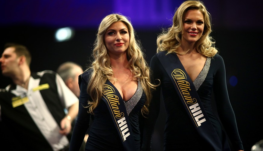LONDON, ENGLAND - DECEMBER 19: The Oche girls make their way off stage during Day Two of the William Hill PDC World Darts Championships at Alexandra Palace on December 19, 2014 in London, England. (Ph ...