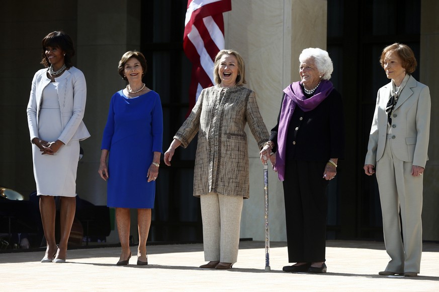 First lady Michelle Obama, left, stands with, from second from left, former first ladies: Laura Bush; Hillary Rodham Clinton; Barbara Bush; and Rosalynn Carter; at the dedication of the George W. Bush ...