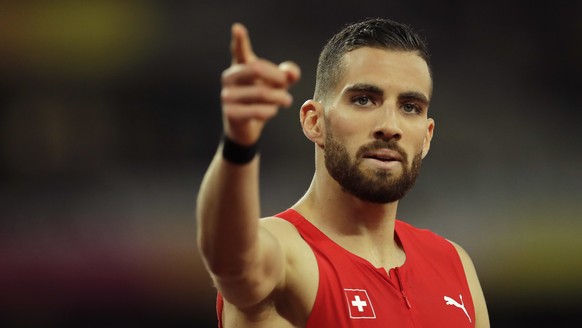 Switzerland&#039;s Kariem Hussein reacts after crossing the finish line at the Men&#039;s 400m hurdles semifinal during the World Athletics Championships in London Monday, Aug. 7, 2017. (AP Photo/Tim  ...