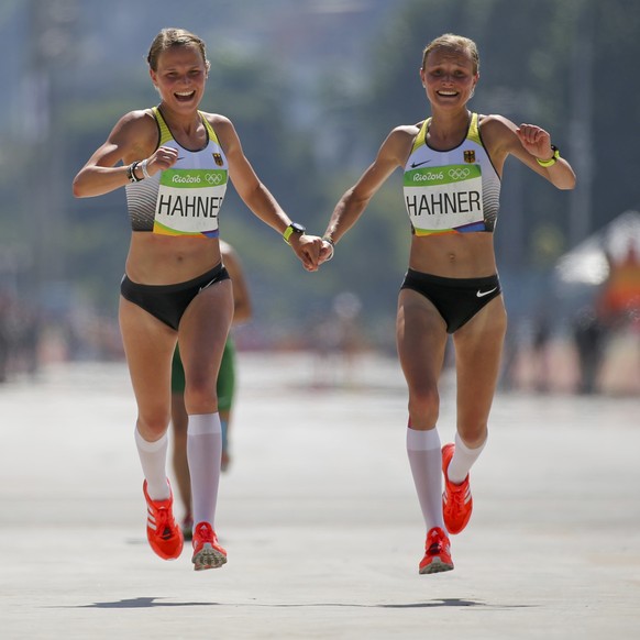 2016 Rio Olympics - Athletics - Final - Women&#039;s Marathon - Sambodromo - Rio de Janeiro, Brazil - 14/08/2016. Lisa Hahner (GER) of Germany and Anna Hahner (GER) of Germany celebrate. REUTERS/Sergi ...