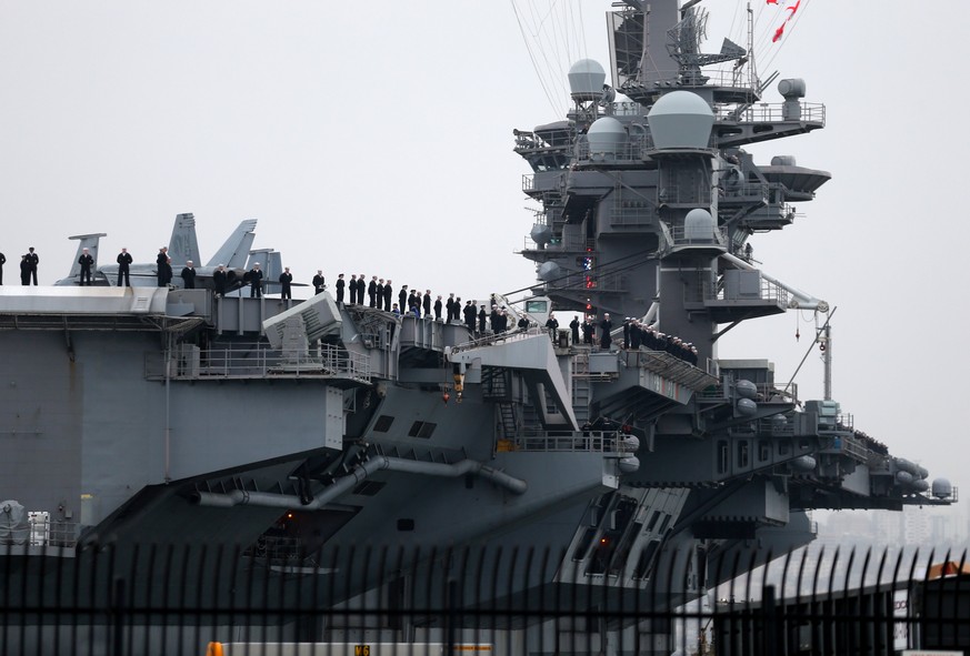 Sailors man the rails as the USS Carl Vinson aircraft carrier departs on deployment from Naval Station North Island in Coronado, California, U.S. January 5, 2017. REUTERS/Mike Blake