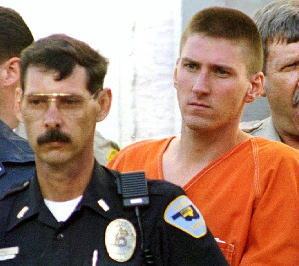 Timothy McVeigh (R) is escorted from the Noble County Courthouse by FBI agents and local police in Perry, Oklahoma, in this file photo taken April 21, 1995. Sunday marks the 20th anniversary of the bo ...