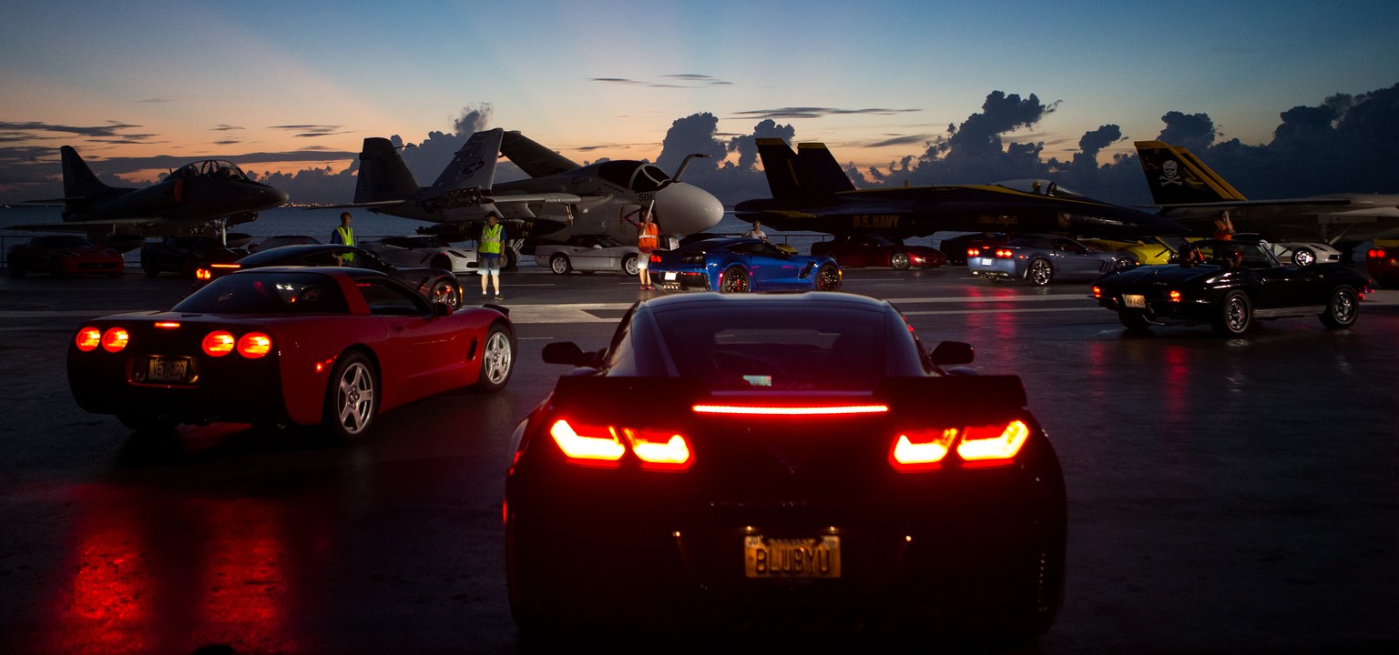 Corvettes drive down the flight deck aboard the U.S.S. Lexington museum by the elevator as they set up for the Jets and Vettes on the Lex event on Saturday Sept. 10, 2016 in Corpus Christi, Texas. (Co ...