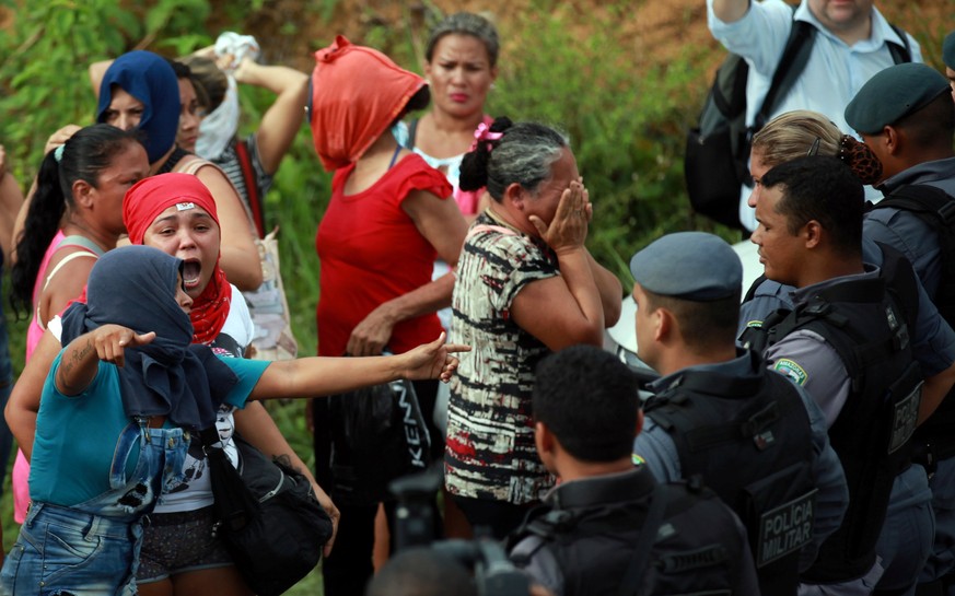 Relatives of prisoners react near riot police at a checkpoint close to the prison where around 60 people were killed in a prison riot in the Amazon jungle city of Manaus, Brazil, January 2, 2017. REUT ...