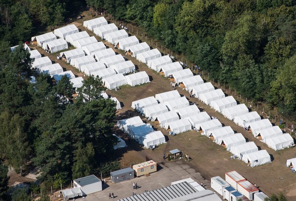epa04927143 Aerial view of a provisory tent village for refugees in Eisenhuettenstadt, Germany, 12 September 2015. The tent village was established because the official refugee reception center in Eis ...