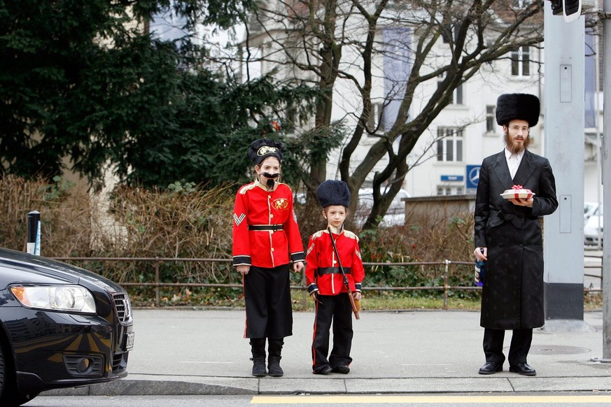 Children and grownups celebrate Purim in the Wiedikon district of Zurich, Switzerland, pictured on March 10, 2009. Purim is a festival commemorating the deliverance of the Jewish people from the threa ...