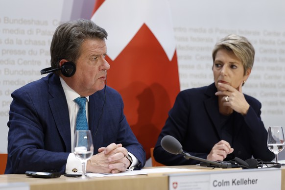 epa10532778 Colm Kelleher (L), Chairman UBS, speaks beside Swiss Finance Minister Karin Keller-Sutter (R), during a press conference in Bern, Switzerland, 19 March 2023. The bank UBS takes over Credit ...