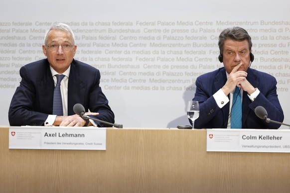 epa10532707 Axel Lehmann (L), Chairman Credit Suisse, speaks beside Colm Kelleher (R), Chairman UBS, during a press conference in Bern, Switzerland, 19 March 2023. The bank UBS takes over Credit Suiss ...