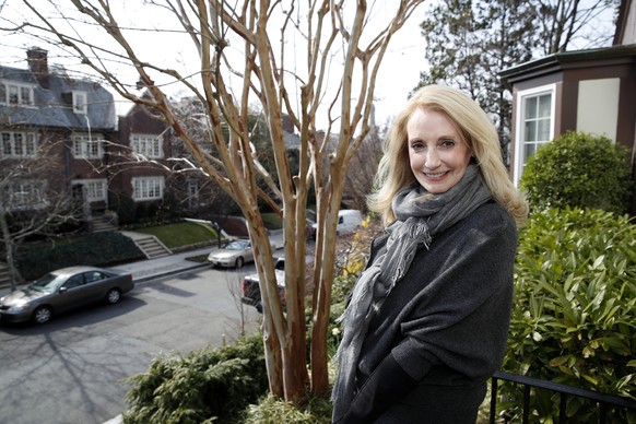 Rhona Wolfe Friedman poses for a picture in front of her home which is next door to the home of Ivanka Trump, Friday, March 24, 2017, in Washington. Residents of a posh Washington neighborhood say the ...