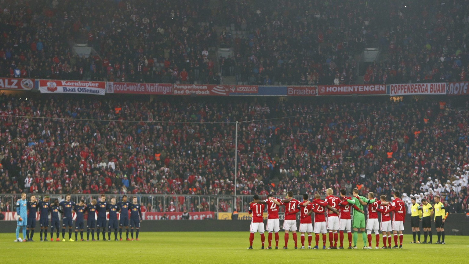 Football Soccer - Bayern Munich v RB Leipzig - German Bundesliga - Allianz-Arena, Munich, Germany - 21/12/16 - RB Leipzig and Bayern Munich players stand during a minute of silence for the 12 killed v ...